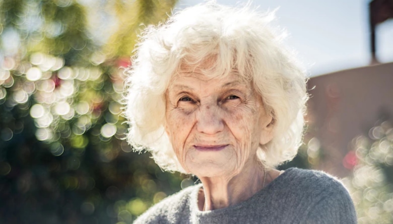 Elderly lady in her backyard