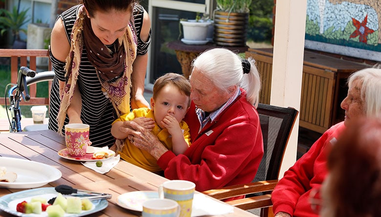 Woman in red sweater sharing quality time with her family