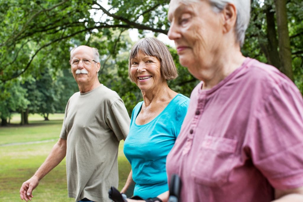 Shot of active and healthy senior people on a morning walk in park